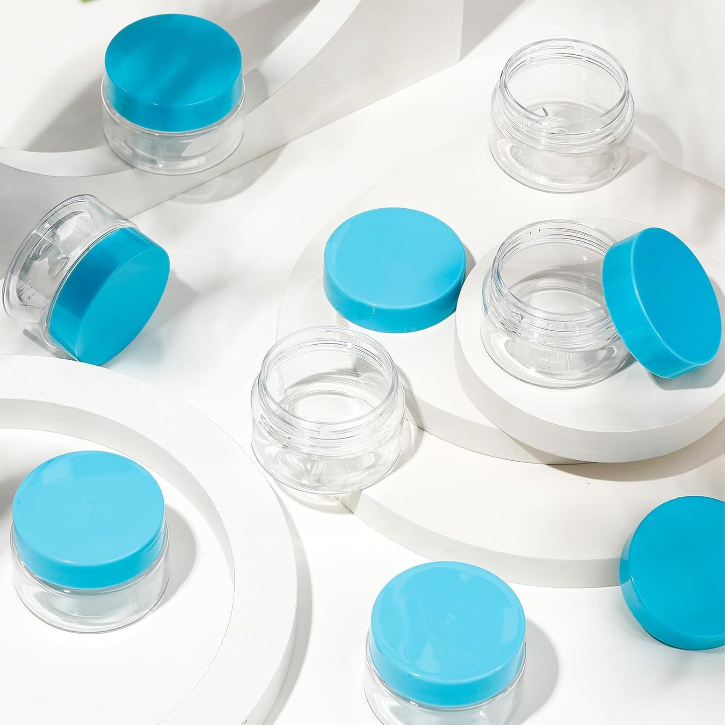 SATINIOR 24 Pieces Empty Clear Plastic Jars with Lids Round Storage Containers Wide Mouth for Beauty Product Cosmetic Cream Lotion Liquid Butter Craft and Food(Blue Lid,1 oz)