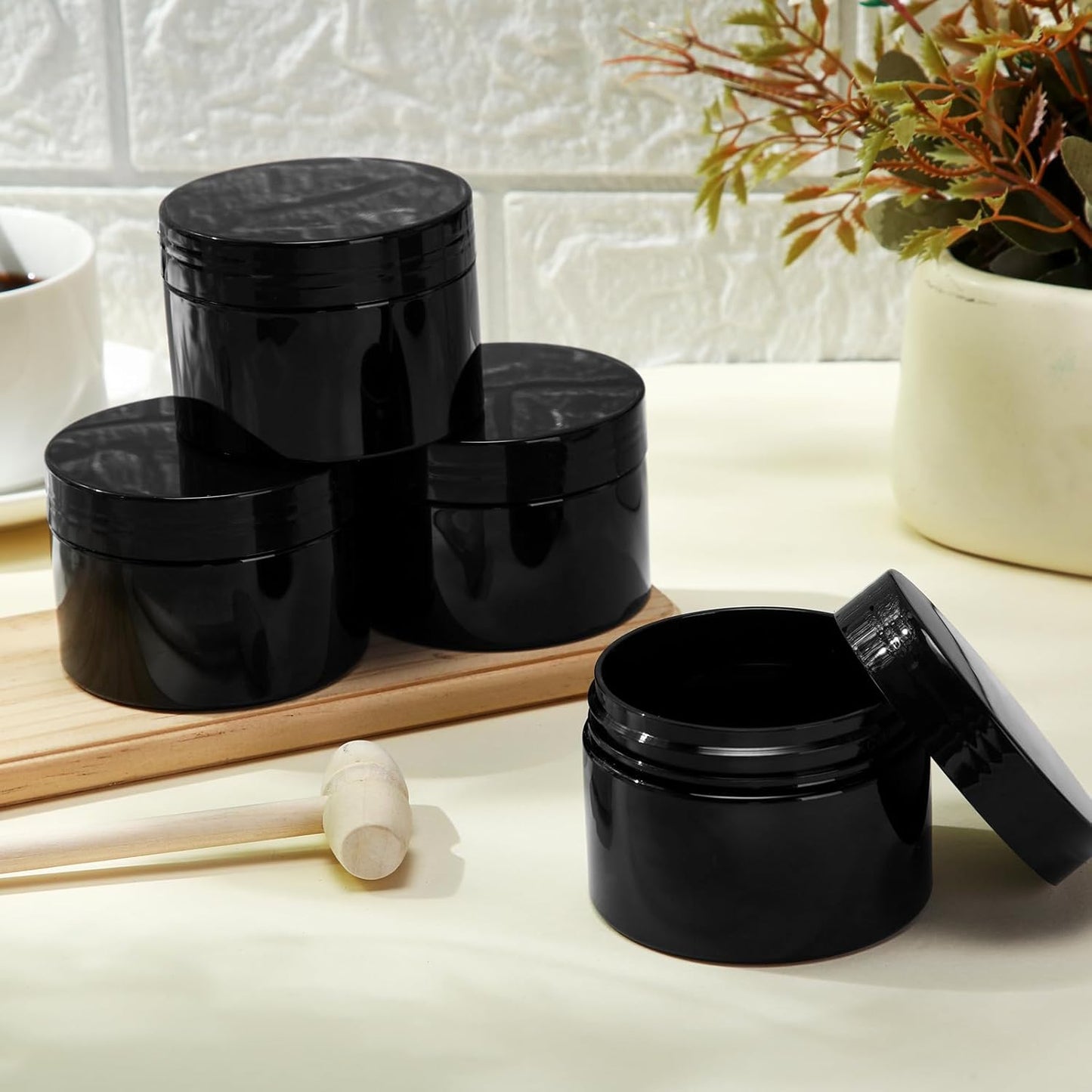 SATINIOR 24 Pieces Empty Clear Plastic Jars with Lids Round Storage Containers Wide Mouth for Beauty Product Cosmetic Cream Lotion Liquid Butter Craft and Food(Black,2 oz)